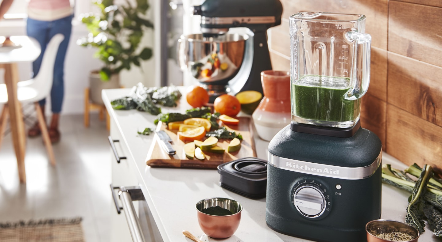 View of kitchen counter with chutney in blender and ingredients View of kitchen counter with chutney in blender and ingredients