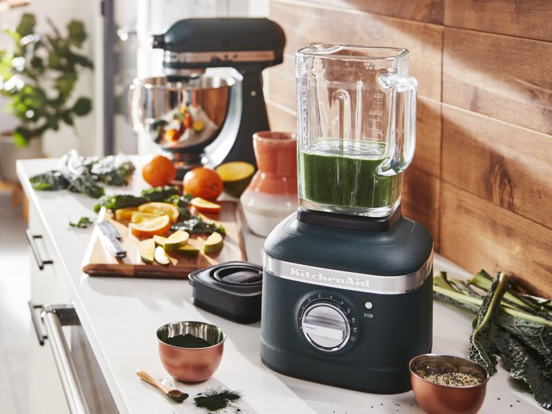 View of kitchen counter with chutney in blender and ingredients View of kitchen counter with chutney in blender and ingredients