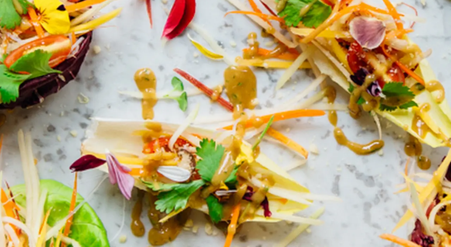 Appetizers topped with shredded vegetables and fresh herbs Appetizers topped with shredded vegetables and fresh herbs