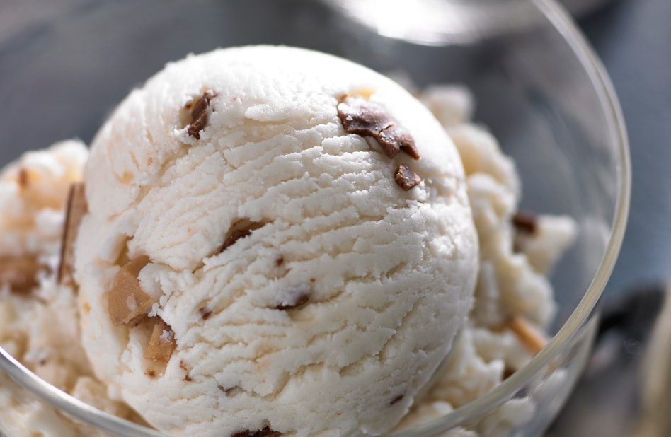 Close up of candy bar ice cream in glass bowl Close up of candy bar ice cream in glass bowl