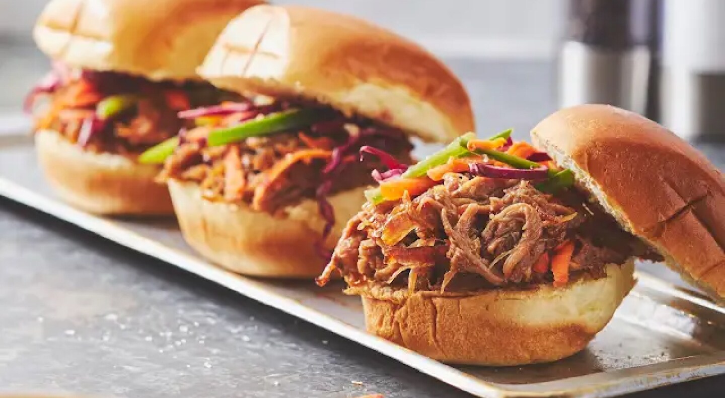 Three pulled pork sandwiches on a plate Three pulled pork sandwiches on a plate