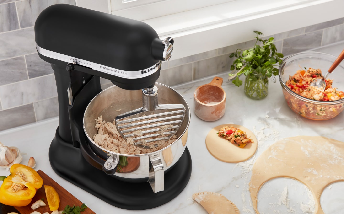 Making empanadas with shredded meat from a stand mixer Making empanadas with shredded meat from a stand mixer