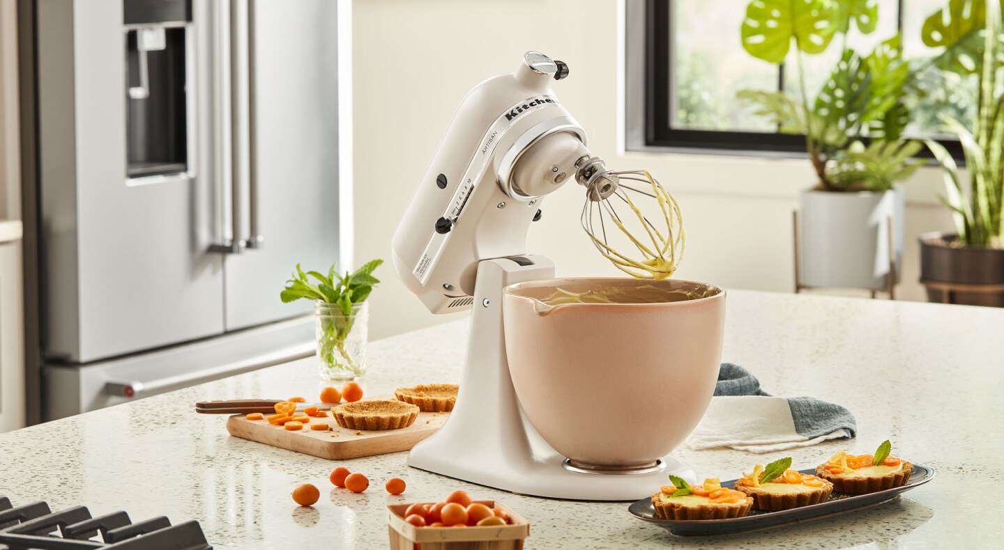 KitchenAid® stand mixer next to mini-quiches on countertop KitchenAid® stand mixer next to mini-quiches on countertop