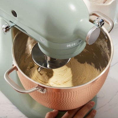 Ingredients being mixed in bowl of KitchenAid® stand mixer