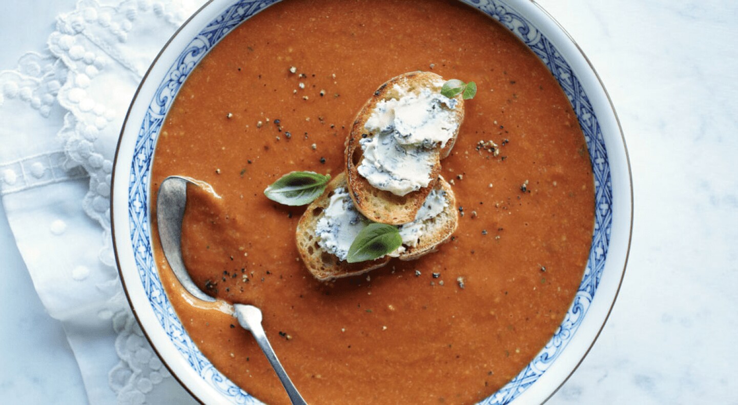 Top view of blended soup in bowl with toasted bread on top Top view of blended soup in bowl with toasted bread on top