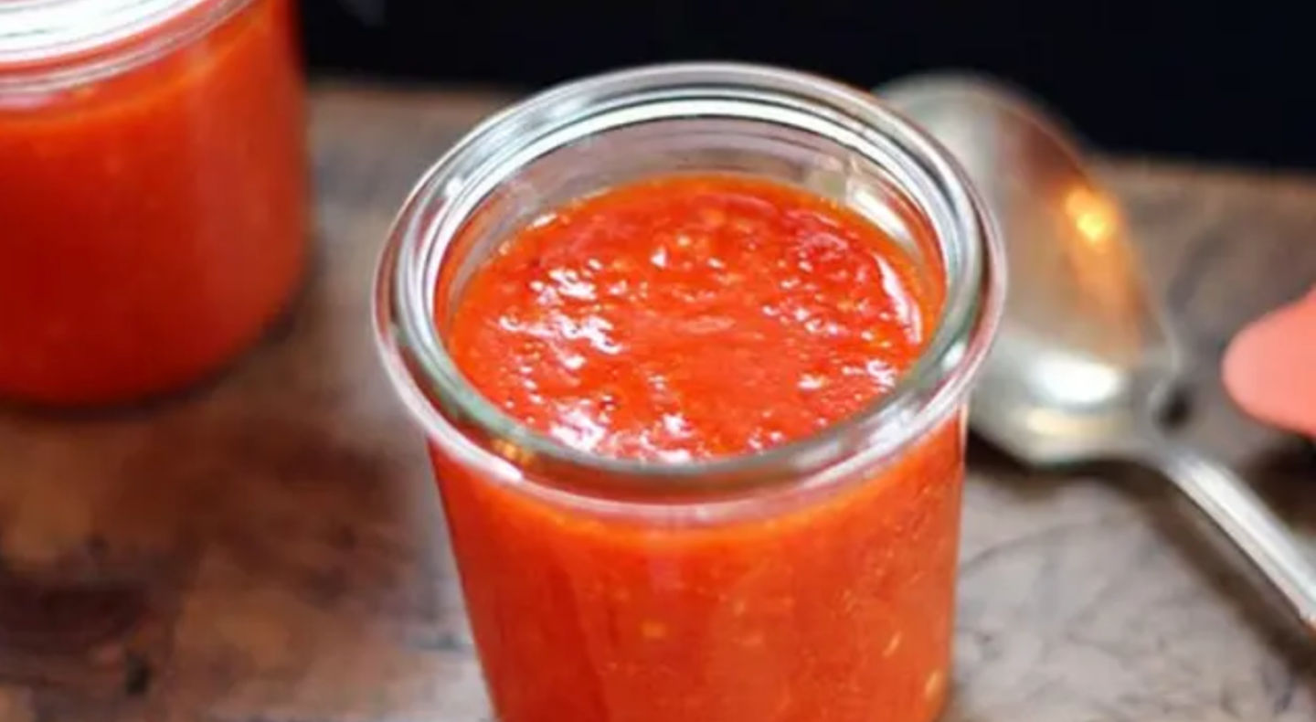 Homemade sriracha in a glass jar Homemade sriracha in a glass jar
