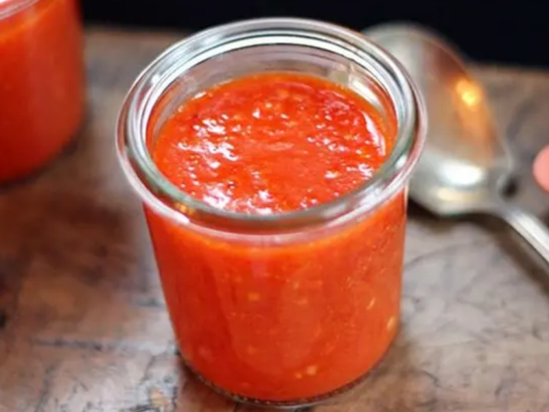 Homemade sriracha in a glass jar Homemade sriracha in a glass jar