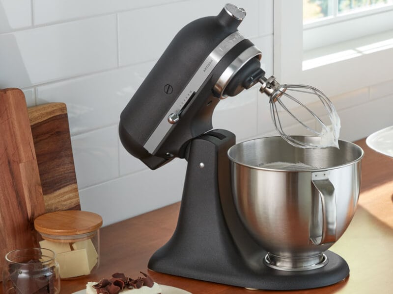 A black KitchenAid® stand mixer and various kitchen items on a countertop A black KitchenAid® stand mixer and various kitchen items on a countertop