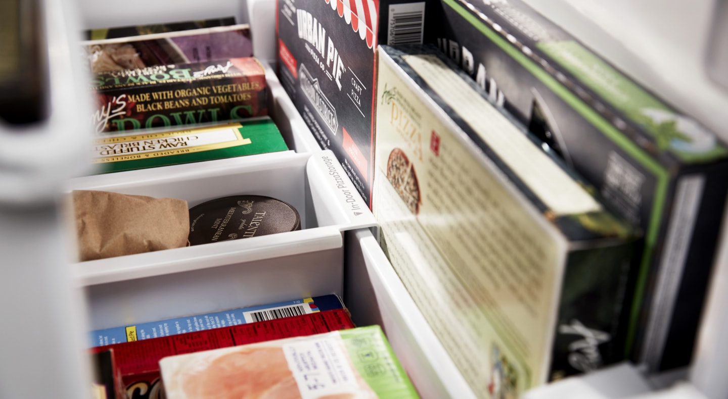 Frozen meals organized in a bottom drawer freezer. Frozen meals organized in a bottom drawer freezer.