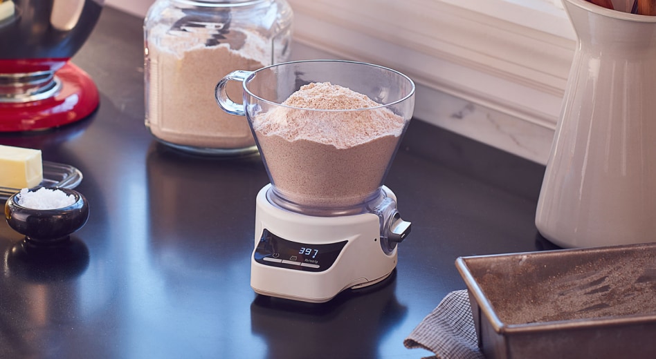 Flour in a measuring cup on a scale Flour in a measuring cup on a scale