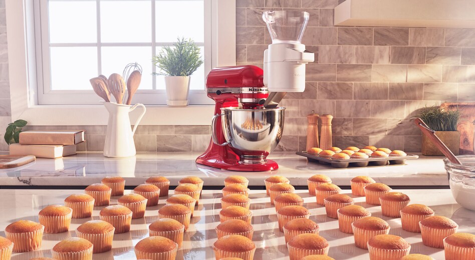Rows of cupcakes in front of a KitchenAid® stand mixer Rows of cupcakes in front of a KitchenAid® stand mixer