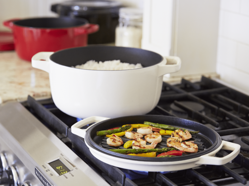 White dutch oven on a stove