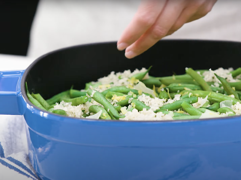 Green beans cooking in a dutch oven
