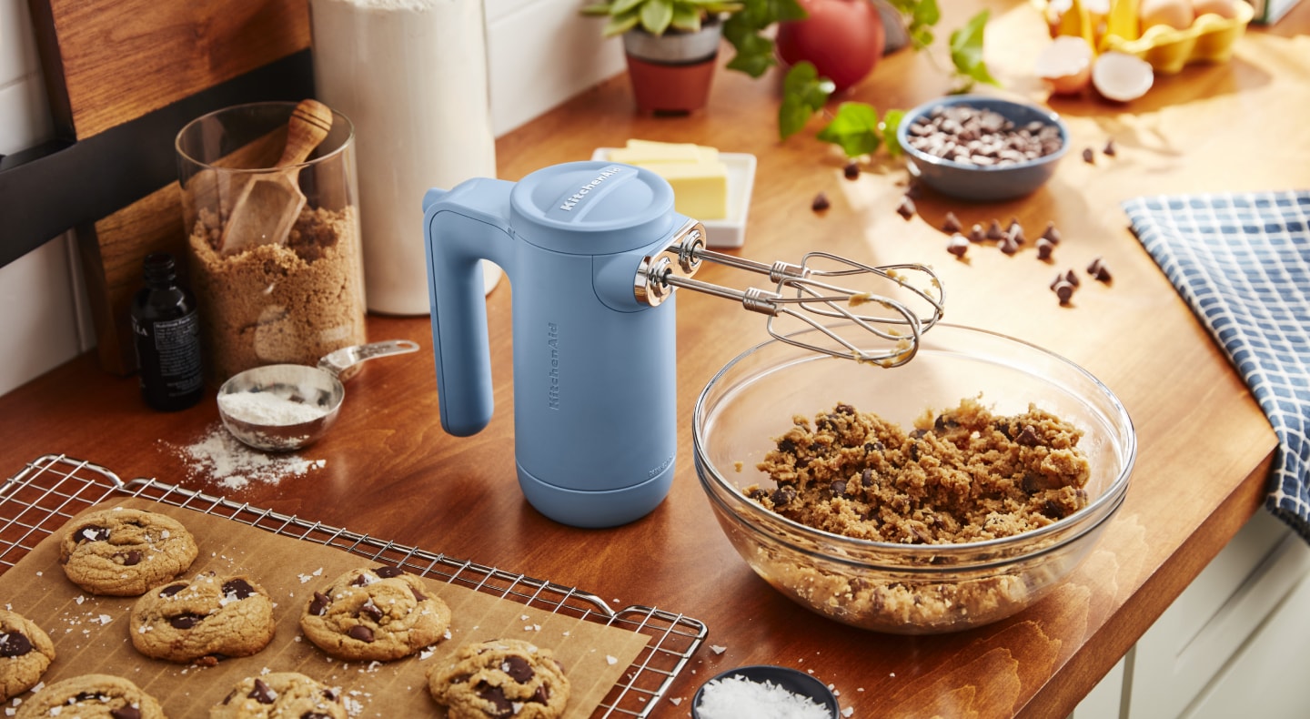 Cordless KitchenAid® hand mixer with cookie dough Cordless KitchenAid® hand mixer with cookie dough