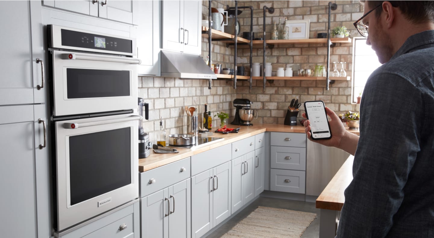 Maker checking settings on phone for KitchenAid Smart Oven+ Maker checking settings on phone for KitchenAid Smart Oven+