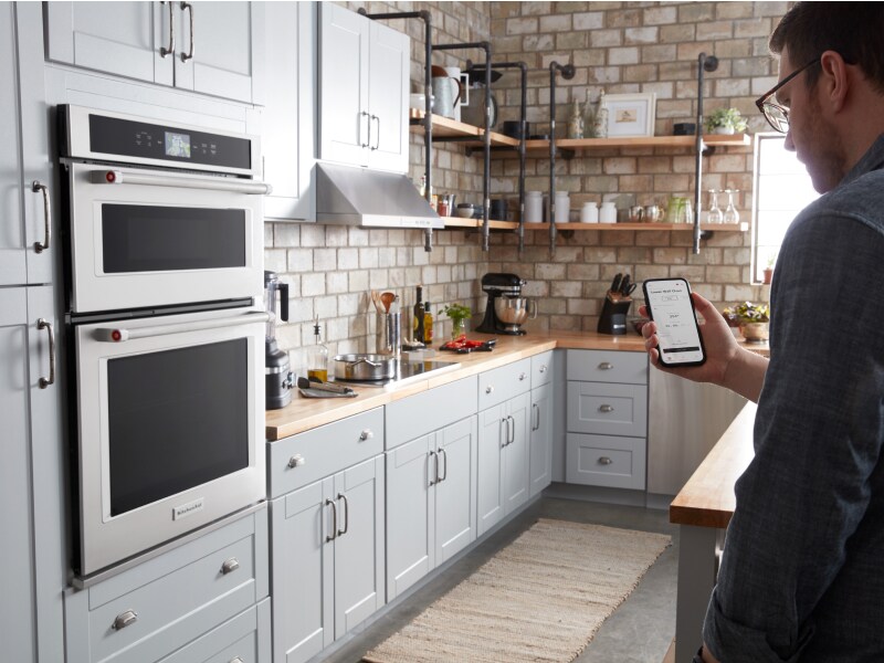 Maker checking settings on phone for KitchenAid Smart Oven+ Maker checking settings on phone for KitchenAid Smart Oven+