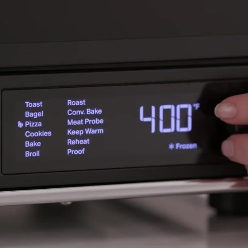 Close-up of air fryer settings menu.