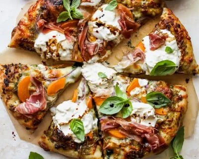 Cut pizza on a cutting board