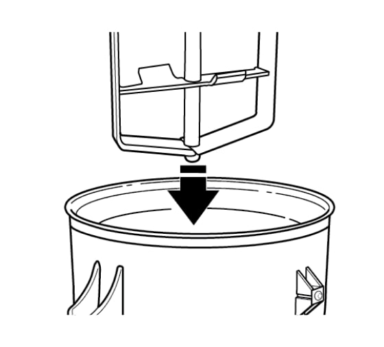 Dasher being lowered into freeze bowl with directional arrow