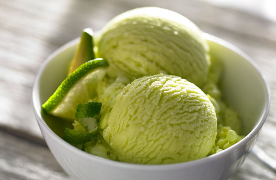 Bowl of homemade green ice cream with lime slices Bowl of homemade green ice cream with lime slices