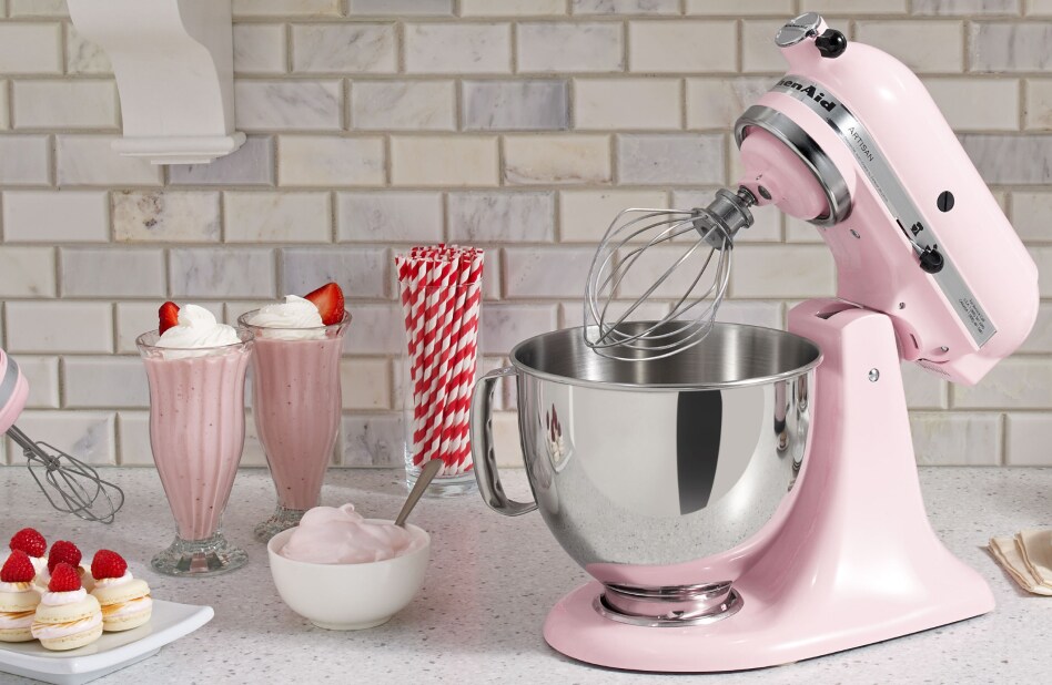 Pink stand mixer surrounded by homemade ice cream recipes Pink stand mixer surrounded by homemade ice cream recipes