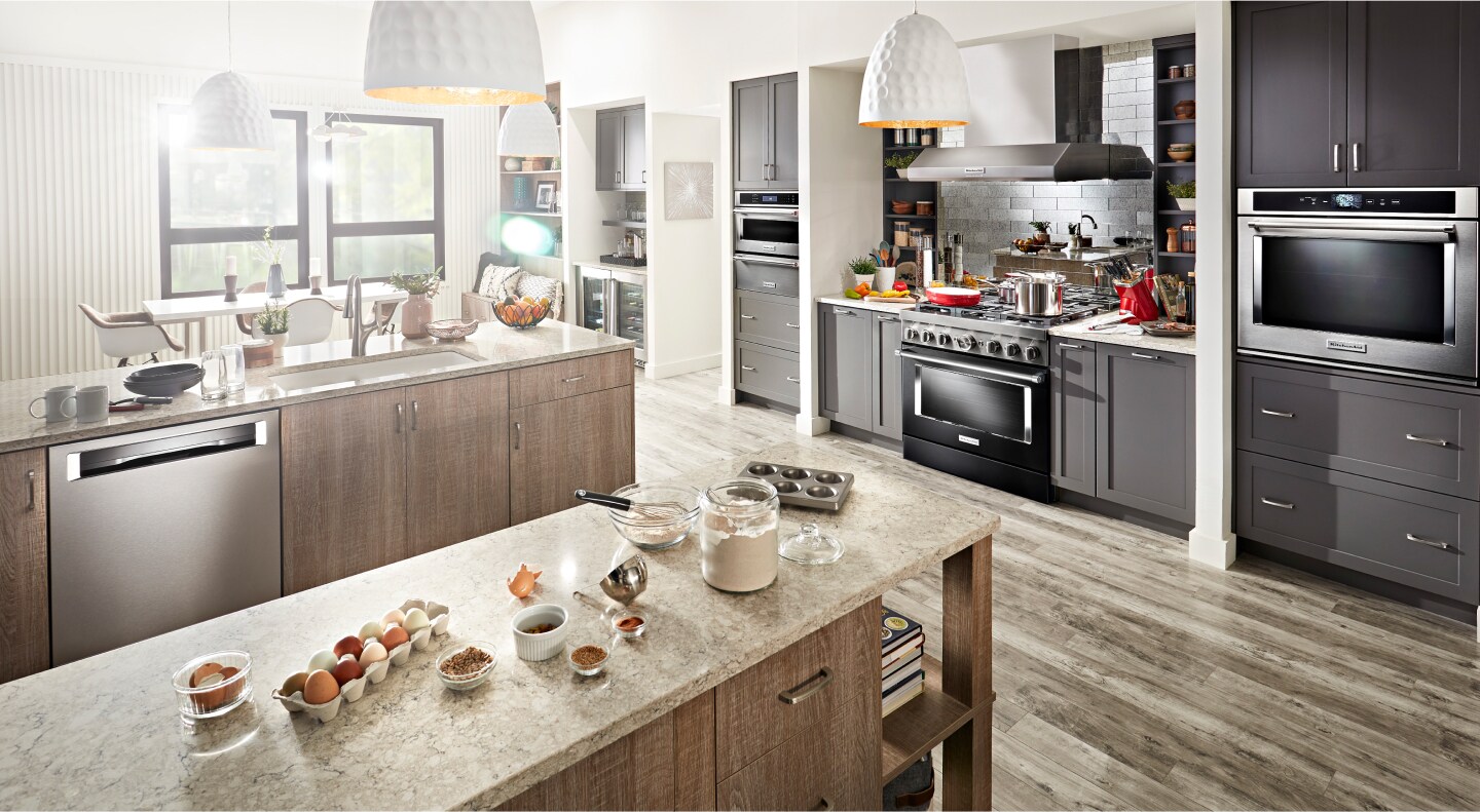 Modern kitchen with ingredients spread out on an island countertop Modern kitchen with ingredients spread out on an island countertop