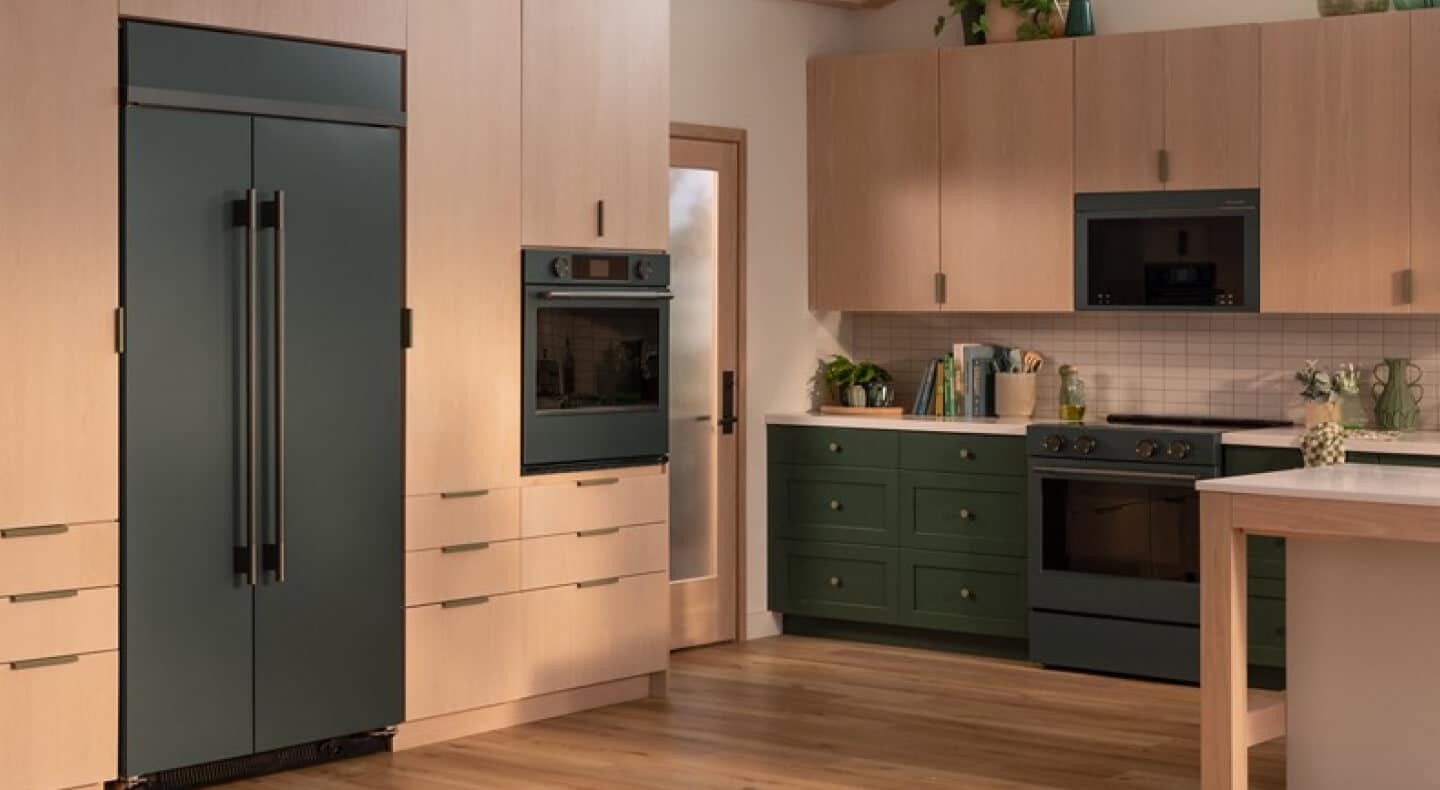Juniper KitchenAid® appliance suite in light wood cabinetry
