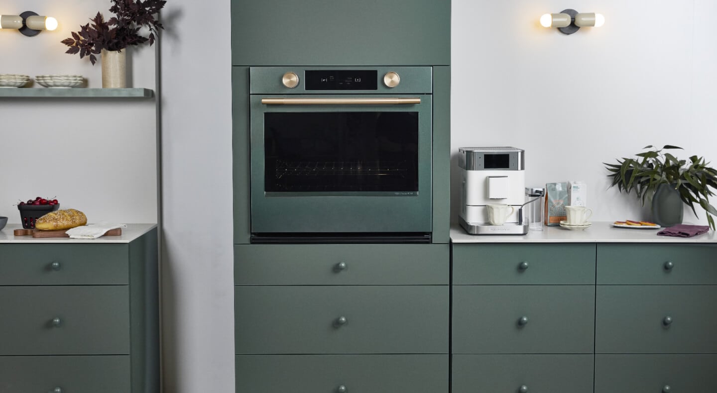 Juniper KitchenAid® Wall Oven blending into Juniper colored cabinetry