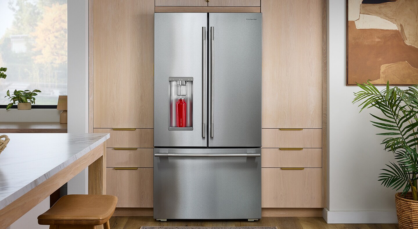 A KitchenAid® Refrigerator with Intelligent Auto Fill in a kitchen