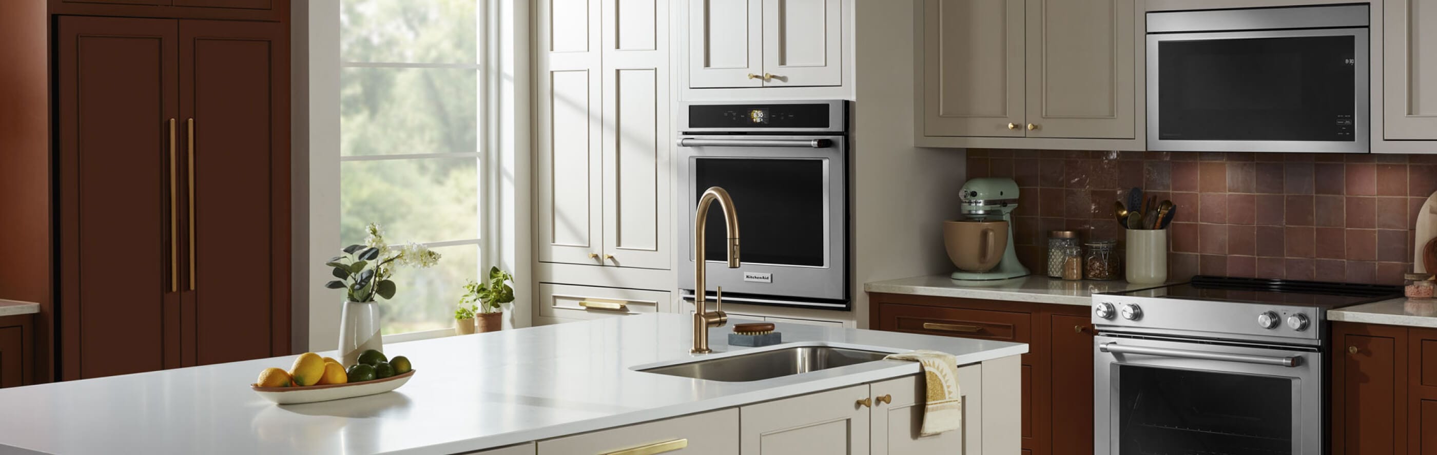 KitchenAid® refrigerator, oven and microwave appliance suite in a modern kitchen