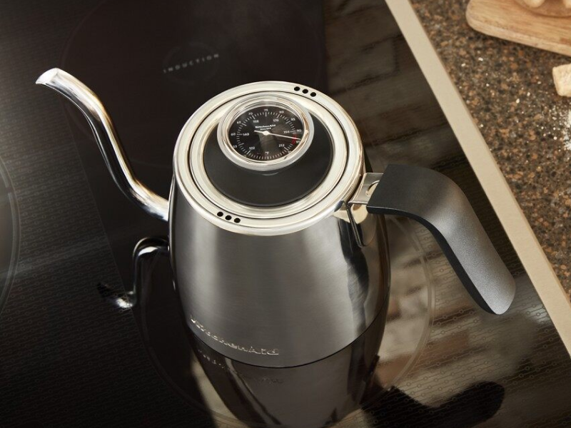 Gooseneck kettle next to pour over coffee maker Gooseneck kettle next to pour over coffee maker
