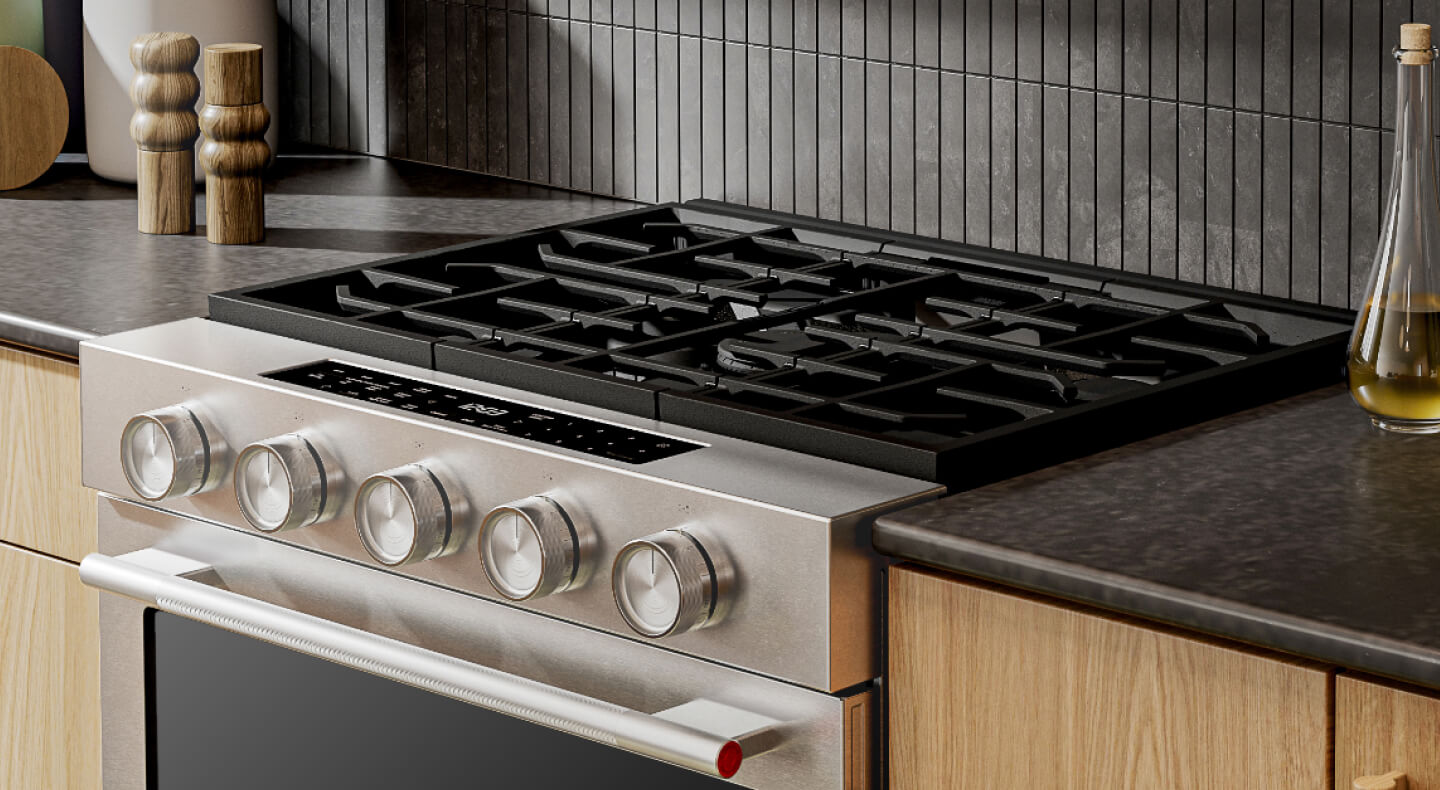 KitchenAid® stainless steel range in light brown cabinetry