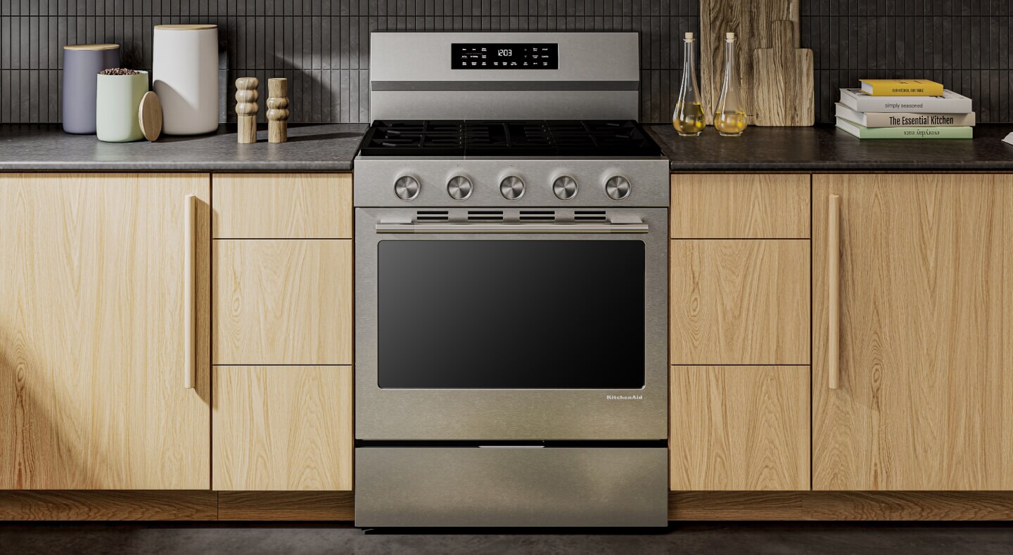 KitchenAid® stainless steel range set in light brown cabinetry
