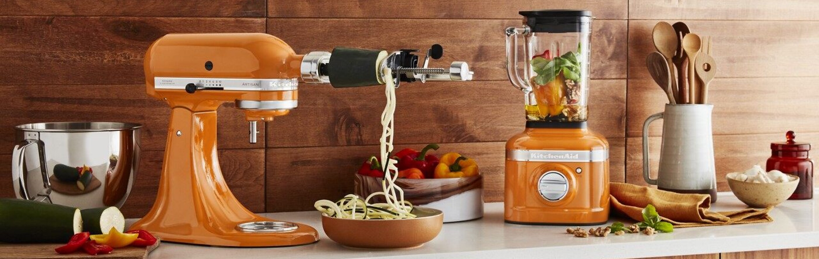 Honey colored KitchenAid® stand mixer and blender on countertop