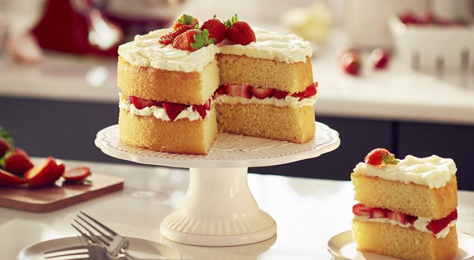 Homemade strawberry shortcake on cake stand Homemade strawberry shortcake on cake stand