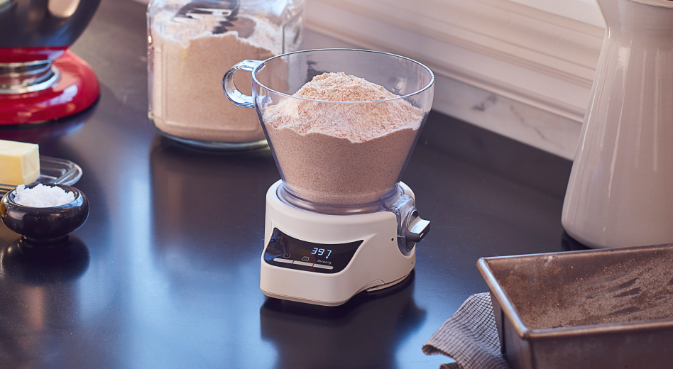 Measuring flour in a kitchen scale Measuring flour in a kitchen scale