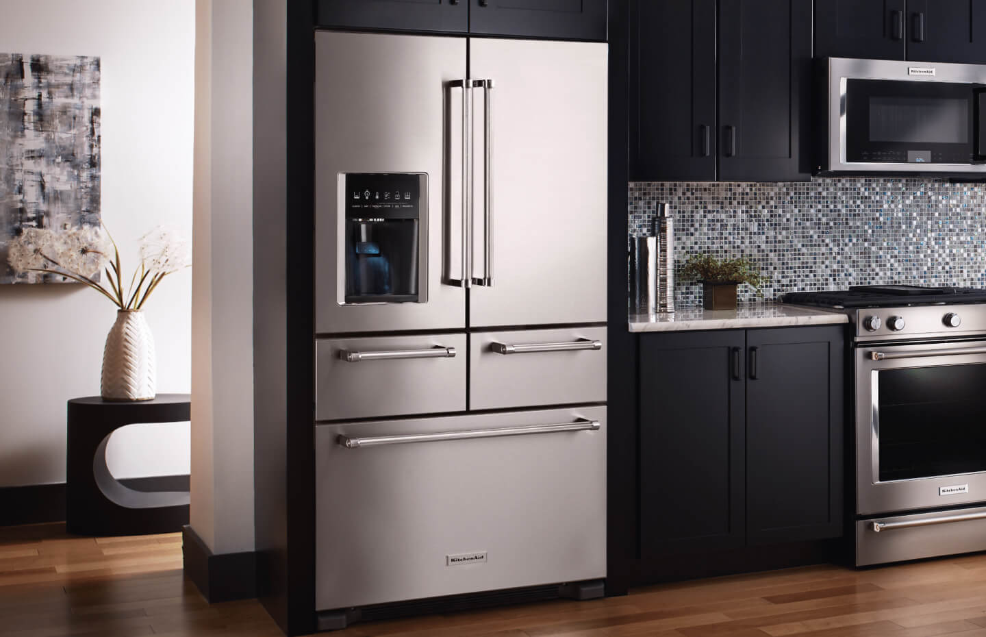 A multi-door KitchenAid® refrigerator in a modern kitchen.