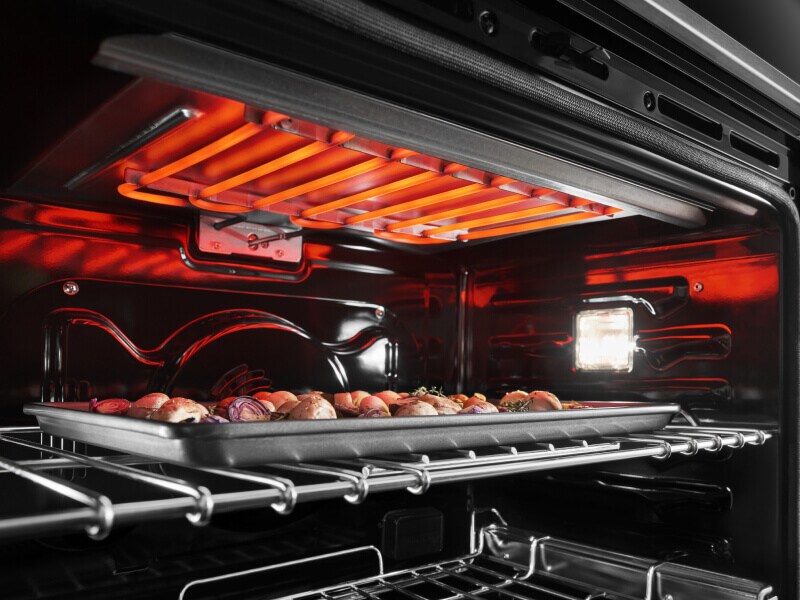 Potatoes broiling inside an oven