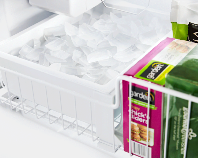 Tray full of ice inside a freezer