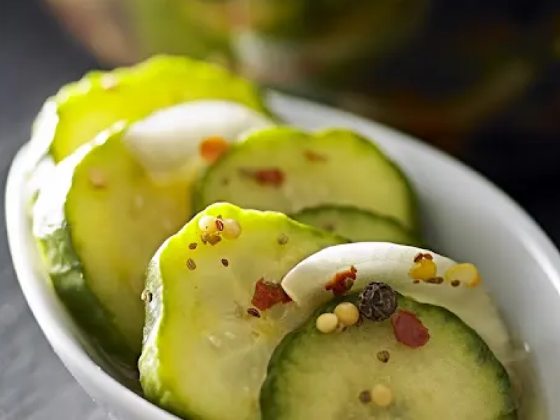 Spiced pickle chips in a white bowl