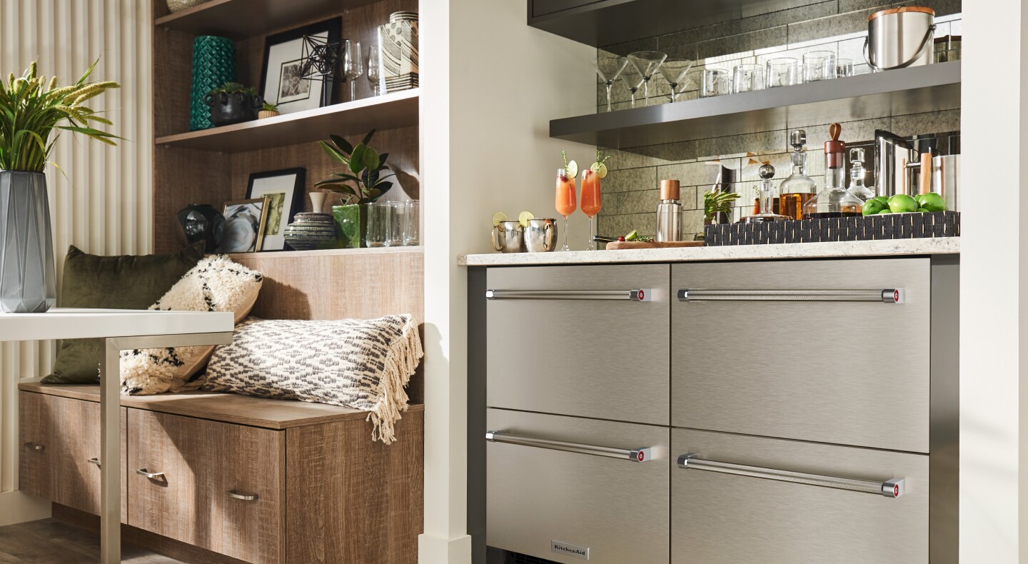 Stainless steel KitchenAid® undercounter refrigerator drawers under a wet bar Stainless steel KitchenAid® undercounter refrigerator drawers under a wet bar