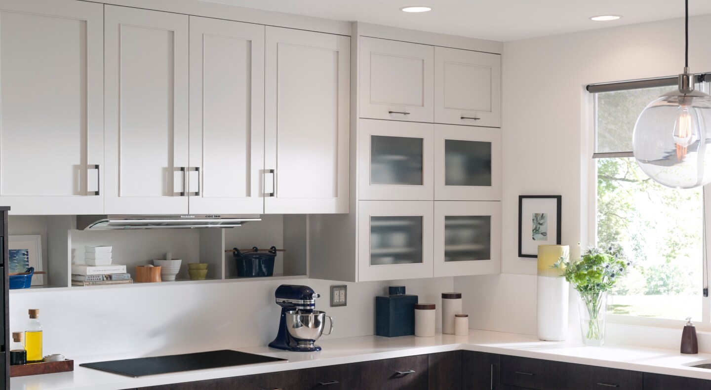 Black KitchenAid® stand mixer in a bright kitchen with white cabinets Black KitchenAid® stand mixer in a bright kitchen with white cabinets