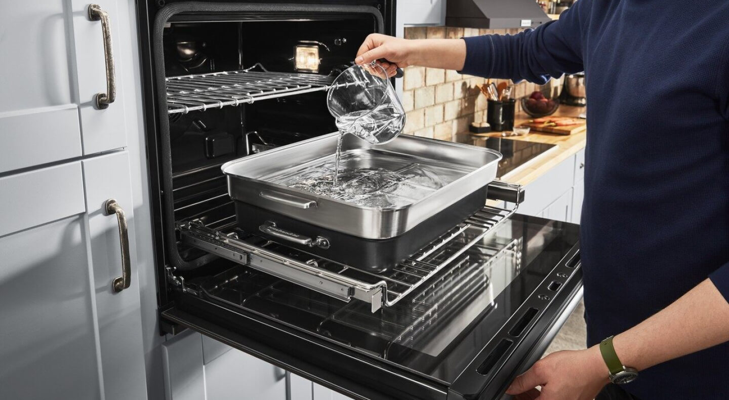Person adding water to a pan