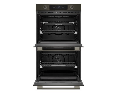 A double wall oven with the doors open showing the interior