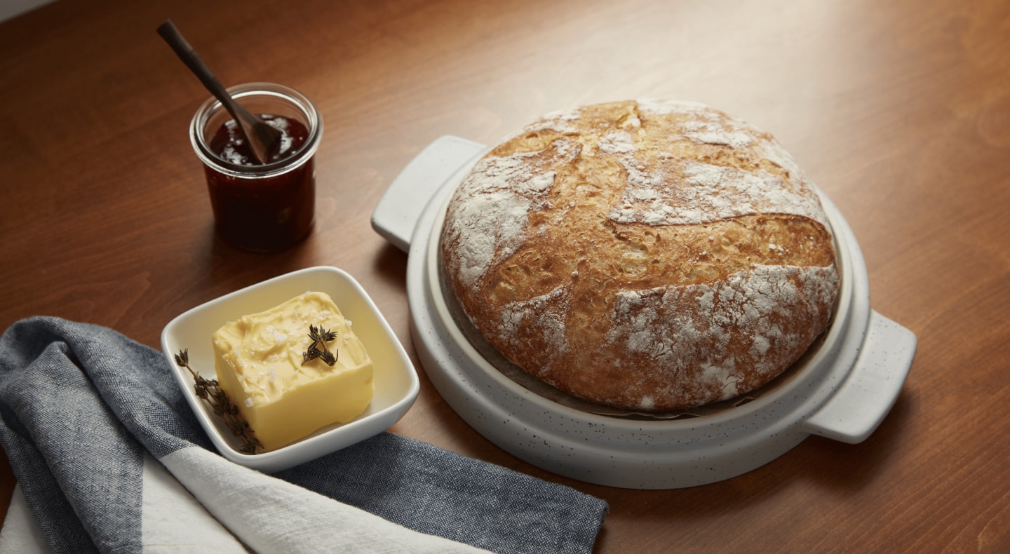 Butter next to bread on a countertop Butter next to bread on a countertop