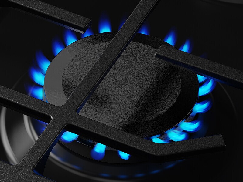 Close-up of blue flame on gas burner