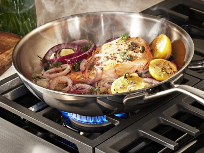 Food in a pan over gas burner