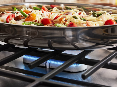 Food cooking over oval gas burner