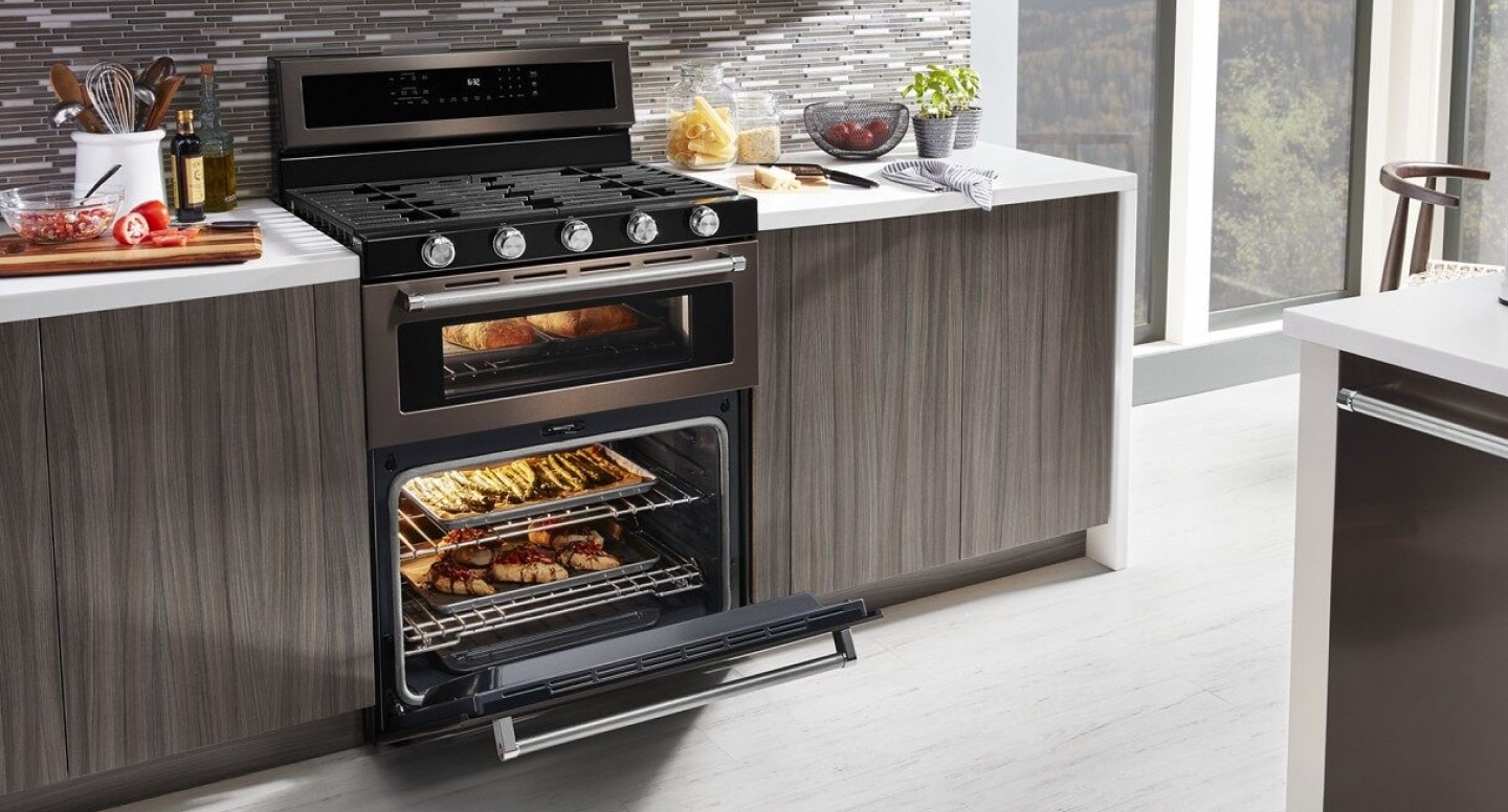 Various dishes cooking in a gas oven range Various dishes cooking in a gas oven range