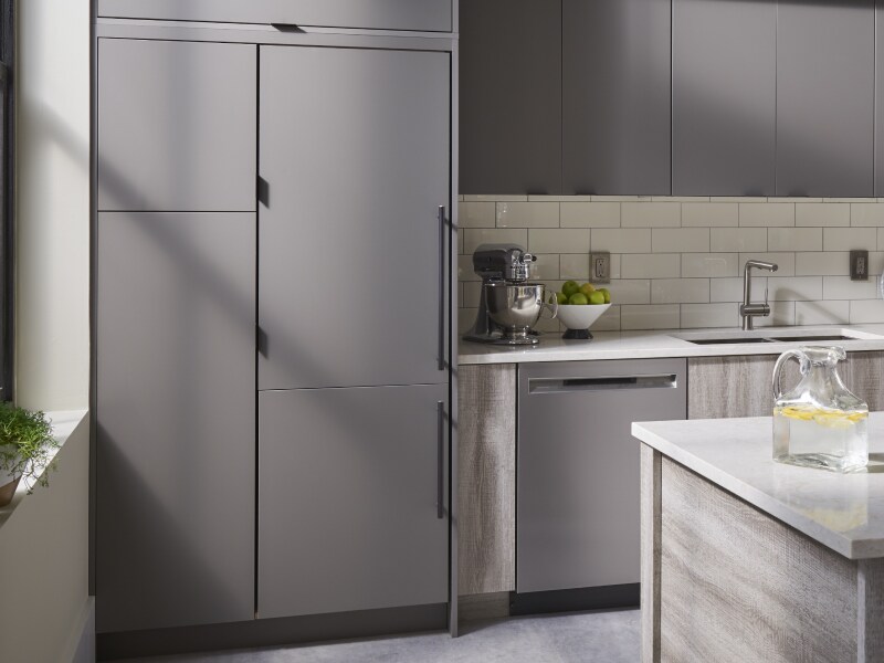 A gray panel-ready refrigerator that matches the surrounding cabinetry
